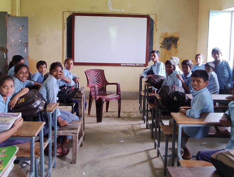 Distribution of chairs and a whiteboard to Nepal Rastriya Adharbhut Vidyalaya.